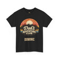 A black short-sleeve crewneck t-shirt featuring a retro-style circular graphic with a sunset landscape and the text 'Dad's Adventure Club' and 'DOMINIC' printed below it.