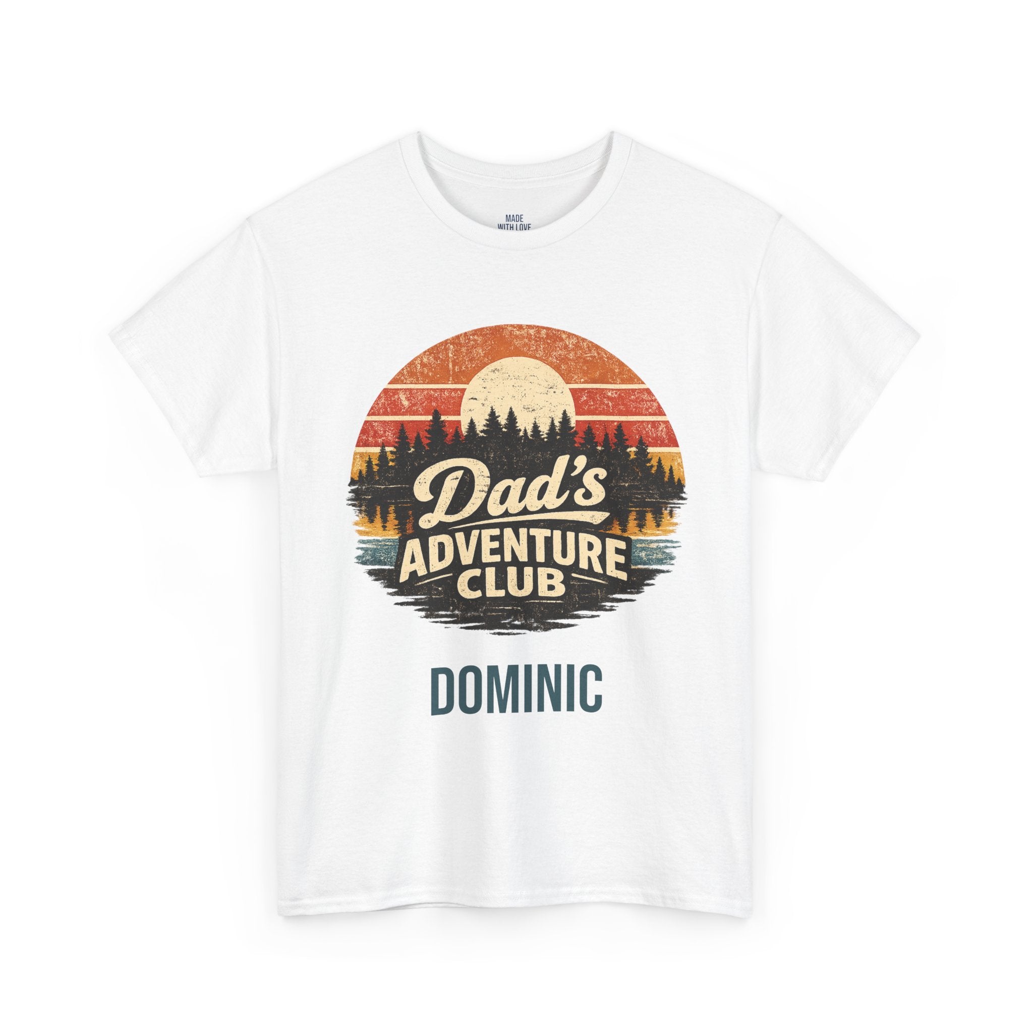 A white short-sleeve crewneck t-shirt featuring a retro circular graphic with a sunset landscape and the text 'Dad's Adventure Club' with 'DOMINIC' printed below in teal.