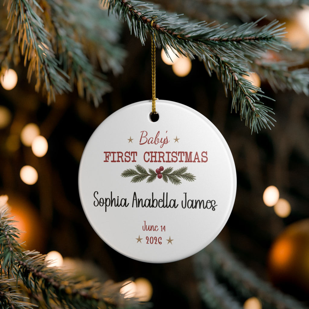 Baby's First Christmas Keepsake ornament hanging on a lit Christmas tree, lifestyle photo