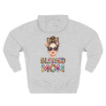 A light heather gray hoodie shown from the back, featuring a colorful graphic of a woman with sunglasses, a leopard-print bow headband, and flowers, with the text 'BLESSED MOM' in a multicolor tie-dye pattern below. For mom.