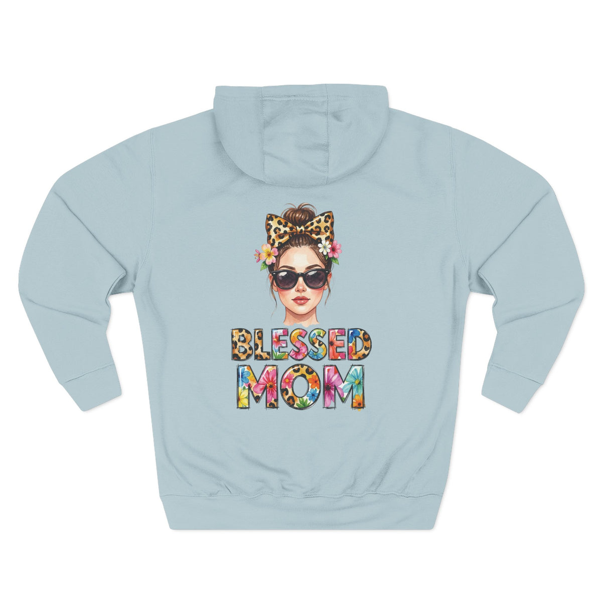A light blue mist hoodie shown from the back, featuring a colorful graphic of a woman with sunglasses, a leopard-print bow headband, and flowers, with the text 'BLESSED MOM' in a multicolor tie-dye pattern below. For mom.