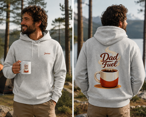 A man wearing a light gray hoodie is shown from both the front and back in an outdoor lakeside setting. The front has a small embroidered name 'James'on the chest is customizable. And the back features a large graphic of a coffee cup with the words 'Dad Fuel' in brown script. 