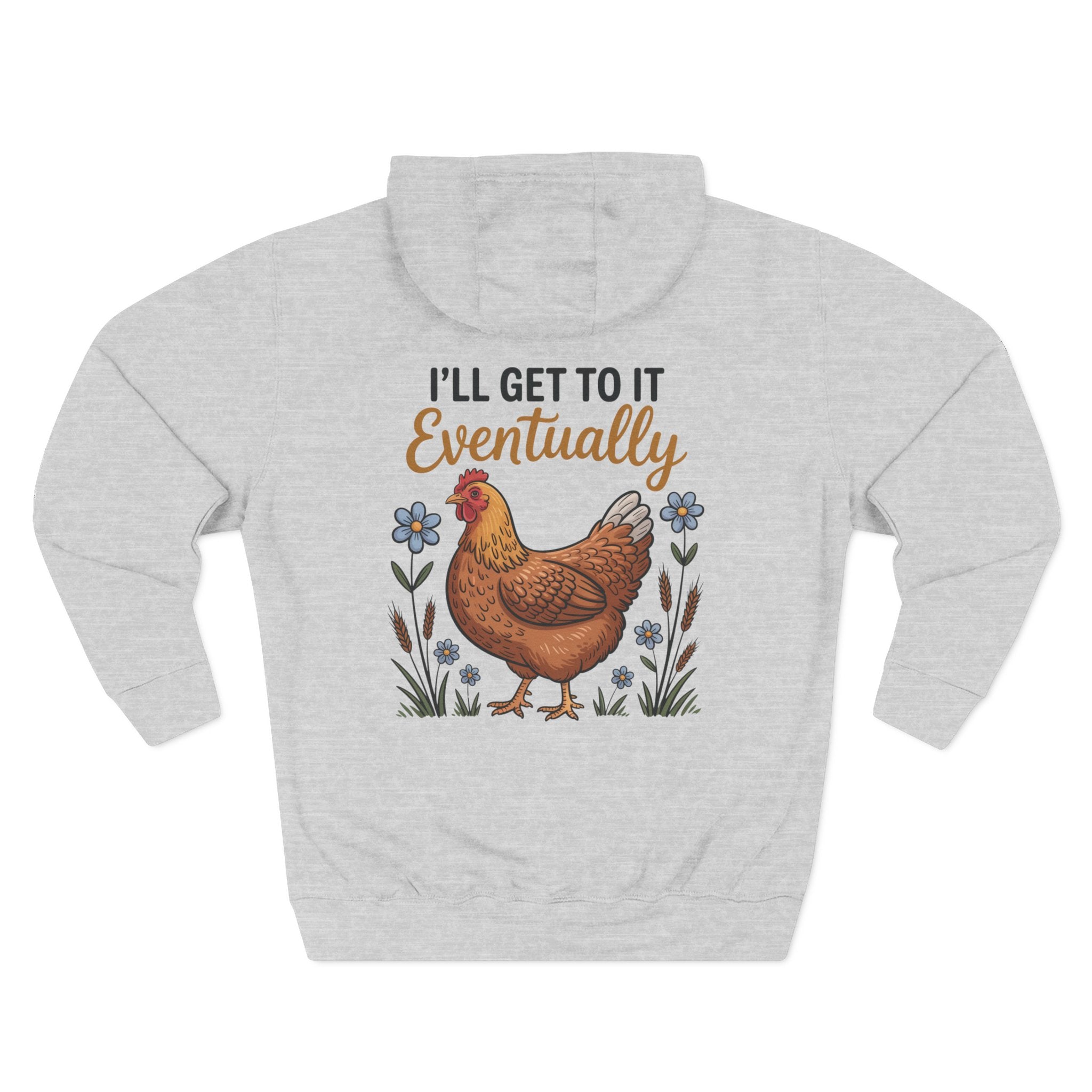 A light heather gray pullover hoodie shown from the back, featuring a graphic print of a brown chicken surrounded by small blue flowers and the text 'I'LL GET TO IT Eventually' in black and brown lettering.