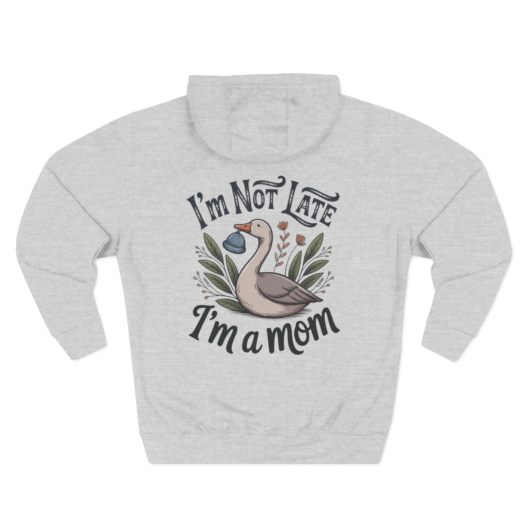 A light heather gray pullover hoodie shown from the back, featuring a graphic print of a mother goose with the text 'I'm Not Late I'm a mom' in a stylized font. Back view of the personalized hoodie printed with "I'm Not Late, I'm a Mom" and embroidered with "Abigail" for mom. Heather grey