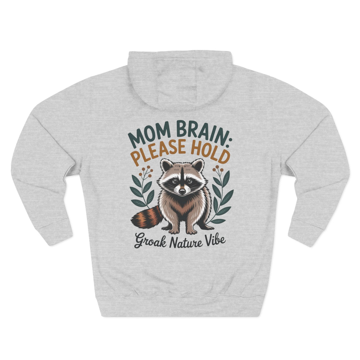 A light heather gray hoodie shown from the back, featuring a graphic of a raccoon with the text 'MOM BRAIN: PLEASE HOLD' and 'Groak Nature Vibe' in green, orange, and dark gray lettering. For mom.
