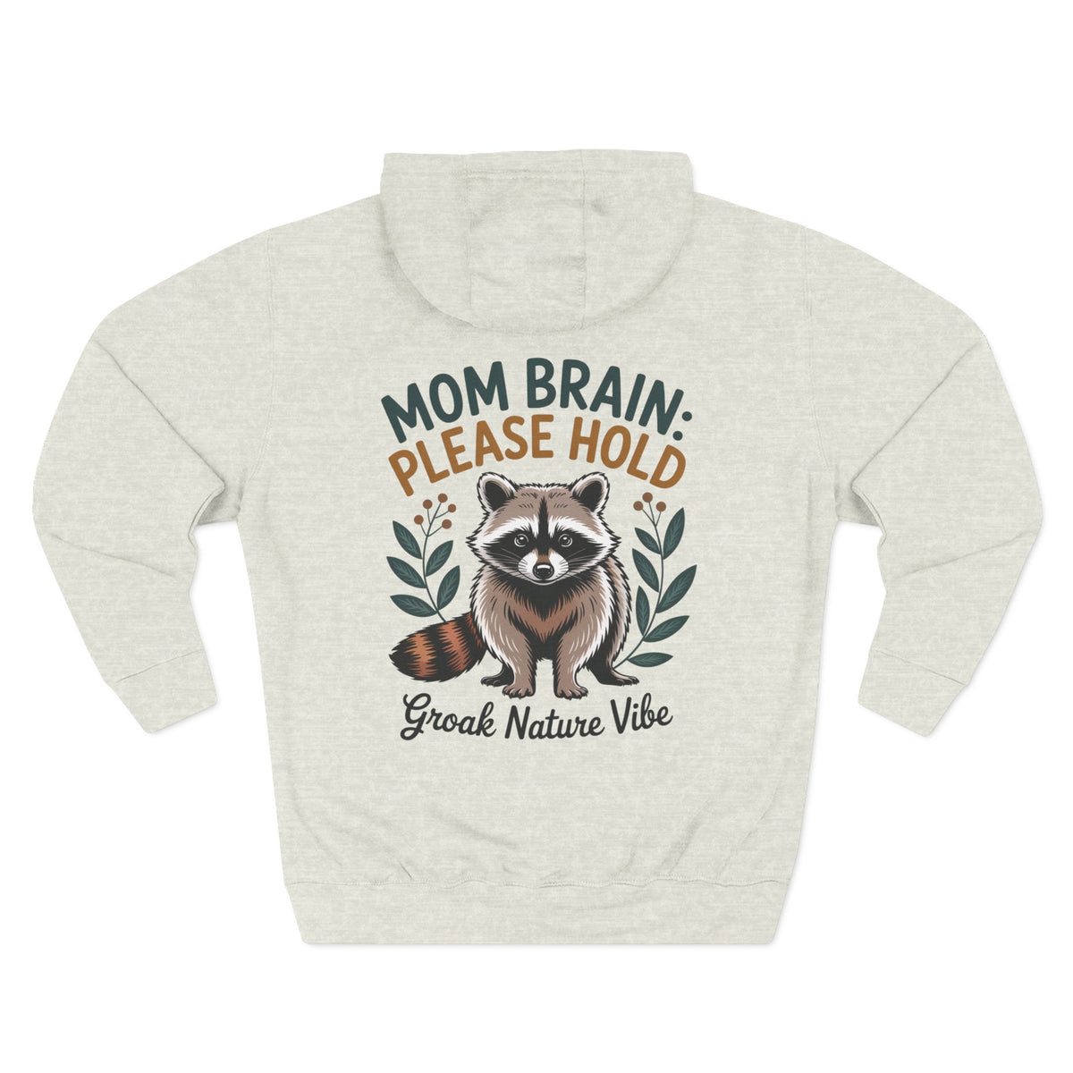 A oatmeal heather hoodie shown from the back, featuring a graphic of a raccoon with the text 'MOM BRAIN: PLEASE HOLD' and 'Groak Nature Vibe' in green, orange, and dark gray lettering. For mom.