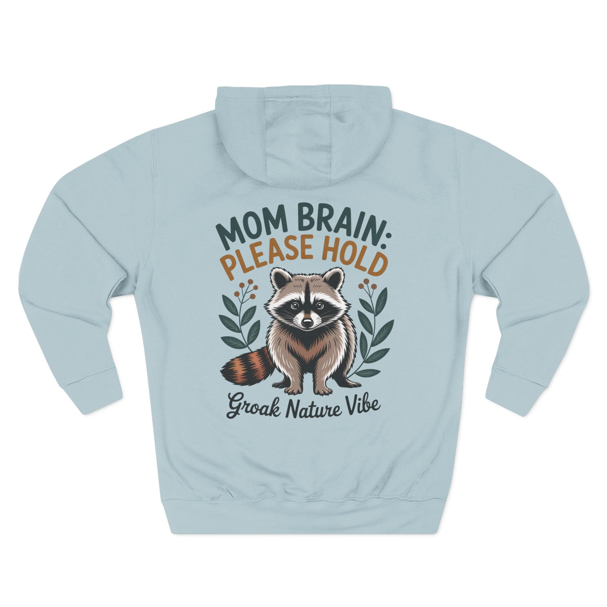 A light blue mist hoodie shown from the back, featuring a graphic of a raccoon with the text 'MOM BRAIN: PLEASE HOLD' and 'Groak Nature Vibe' in green, orange, and dark gray lettering. For mom.