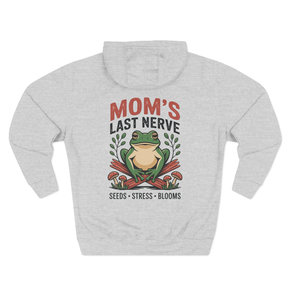 A light heather gray hoodie shown from the back, for Mom, featuring a colorful graphic of a green frog sitting on crossed red stakes with the text 'MOM'S LAST NERVE' above and 'SEEDS * STRESS * BLOOMS' below.