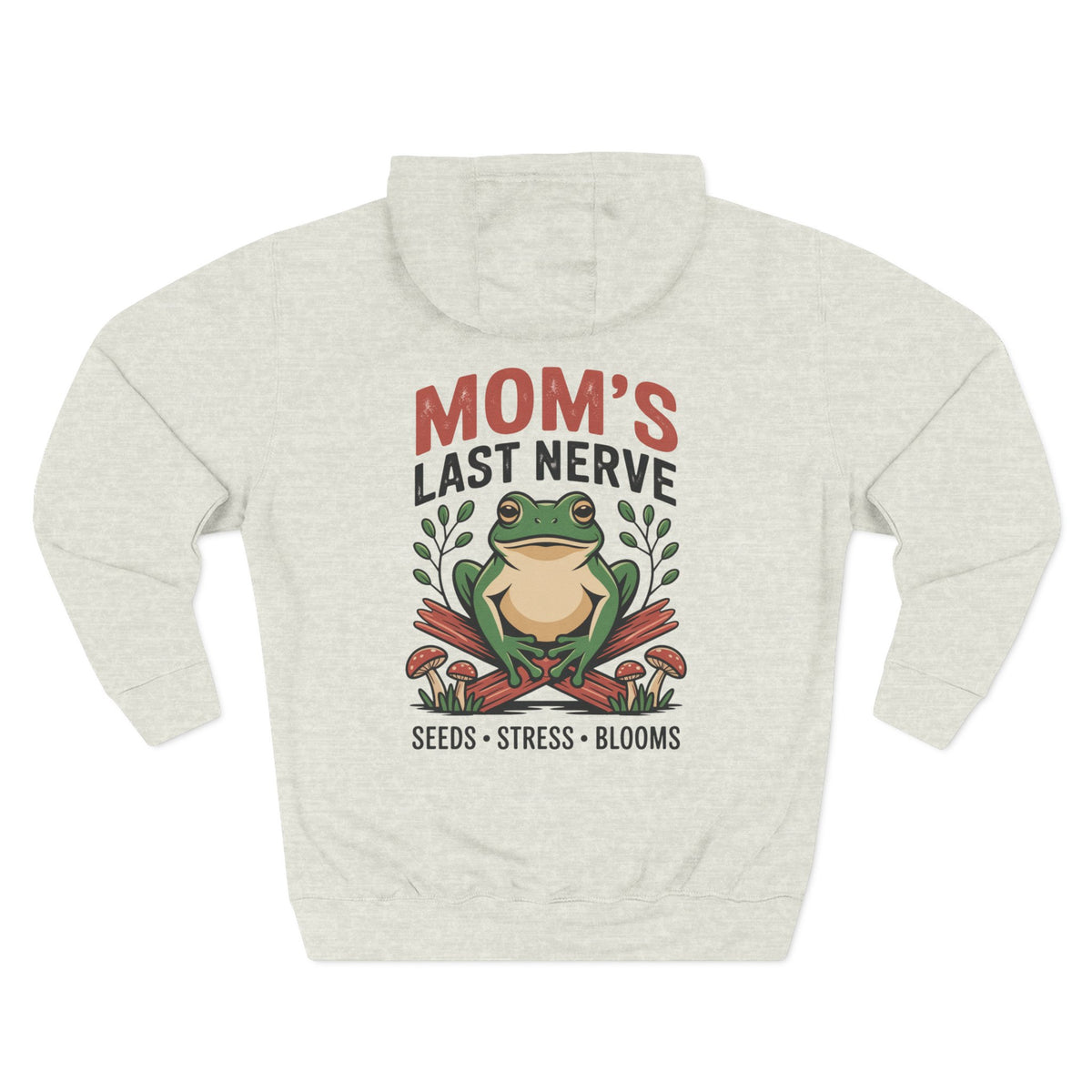 A light oatmeal heather hoodie shown from the back, for Mom, featuring a graphic print of a green tree frog sitting on red mushrooms with the text 'MOM'S LAST NERVE' and 'SEEDS - STRESS - BLOOMS'.