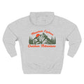 Back view of a light grey personalizable hoodie printed with "Mountain Explorer – Outdoor Adventure" and embroidered with "Christiano". Special gift for him,dad,granddad,boyfriend.