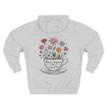 Back view of the personalized hoodie printed with "Peace Begins with a Cup of Tea" and embroidered name