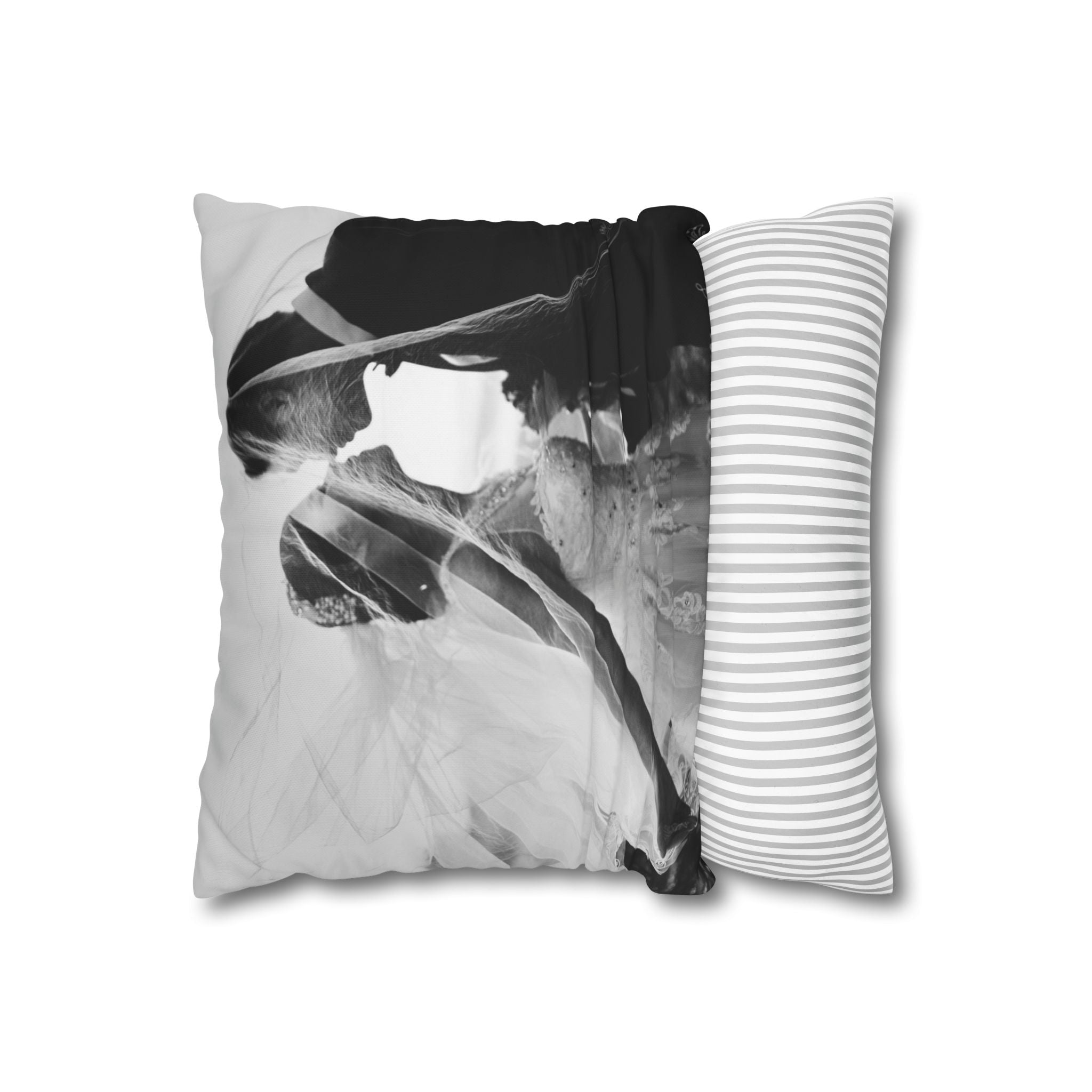 Monochrome wedding photo pillow resting on a bed
