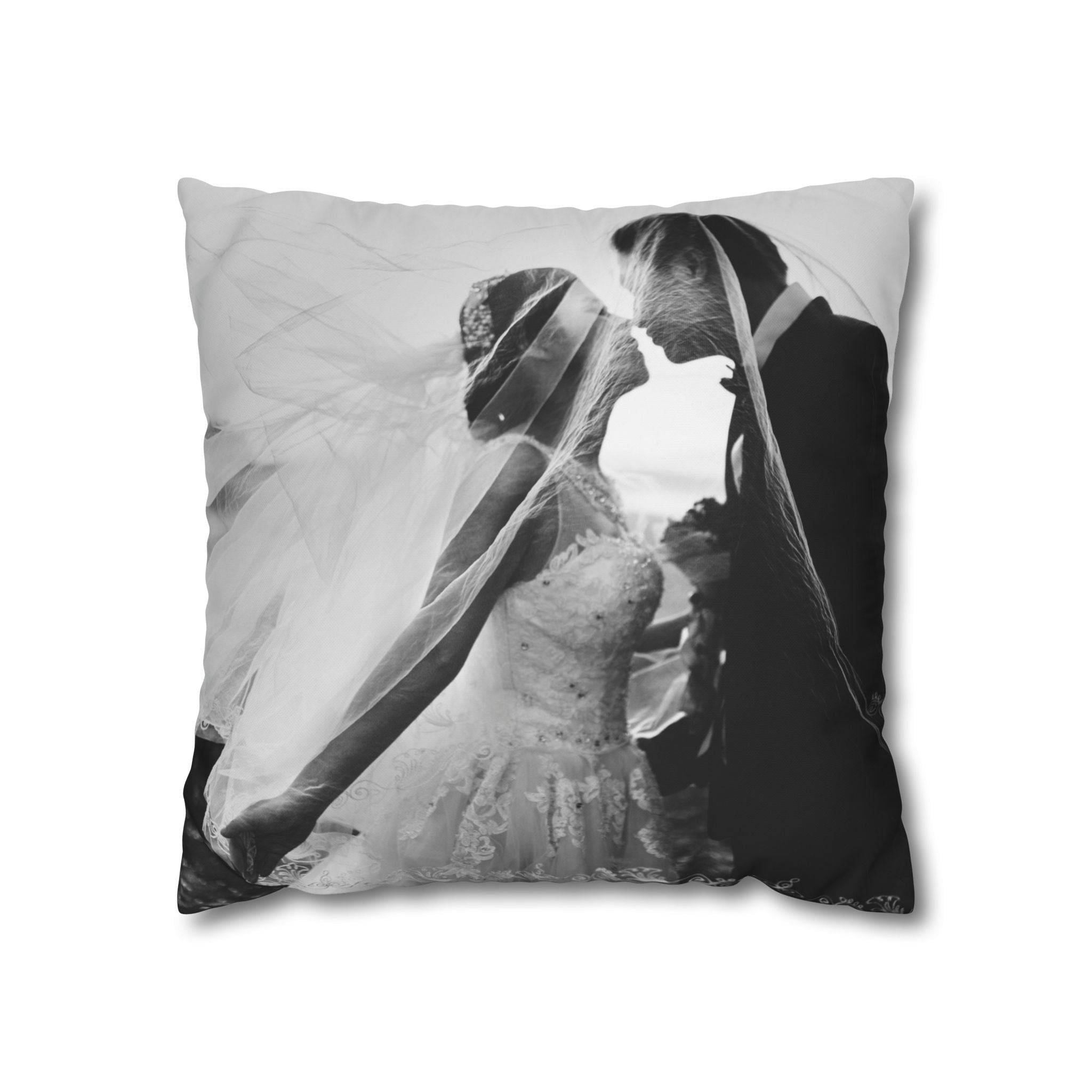 Black-and-white wedding photo pillow styled on a living-room sofa