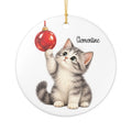 Personalized Christmas Kitten ornament with a gray tabby kitten batting a red Christmas bauble, front view