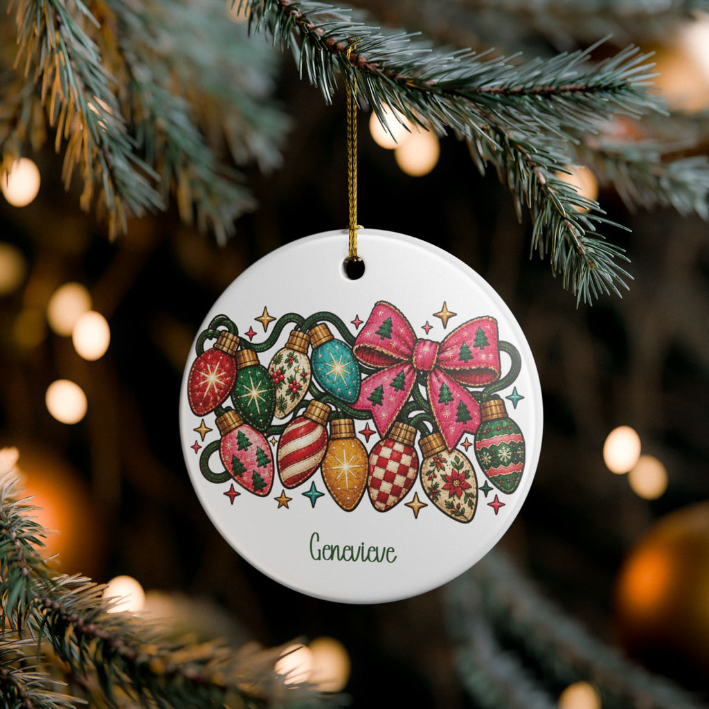 Custom vintage Christmas lights name ornament on pine branches with twinkling Christmas lights