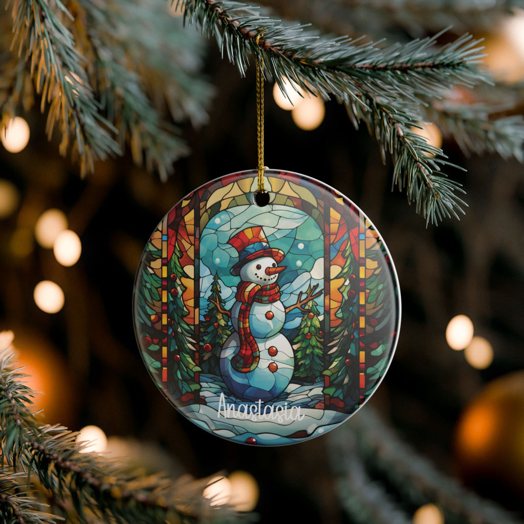 Custom forest stained glass snowman ornament on pine branches with twinkling Christmas lights