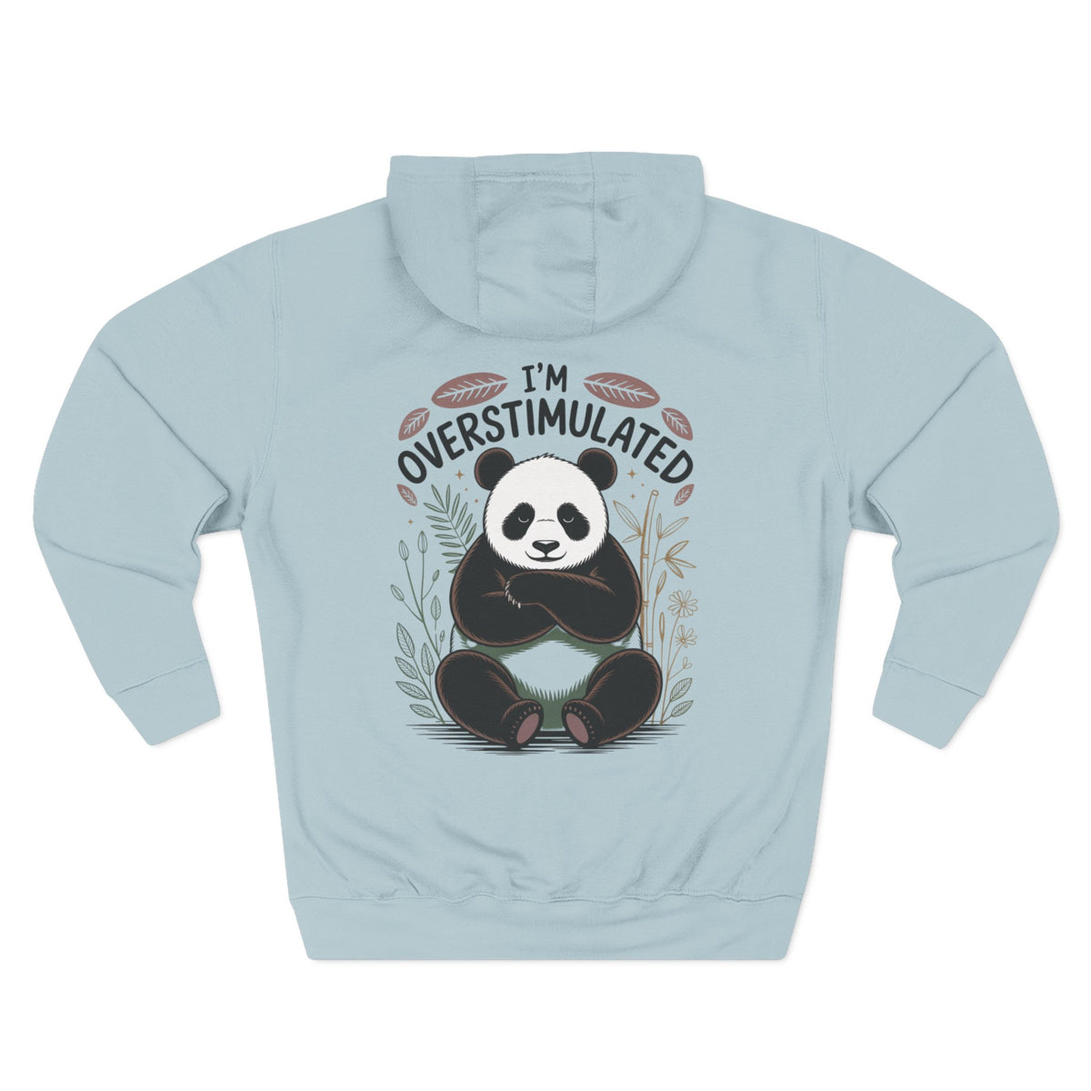 A blue mist long-sleeve hoodie with a graphic of a panda sitting in the center, surrounded by the text 'I'M OVERSTIMULATED' and small botanical illustrations. For her or for Mom