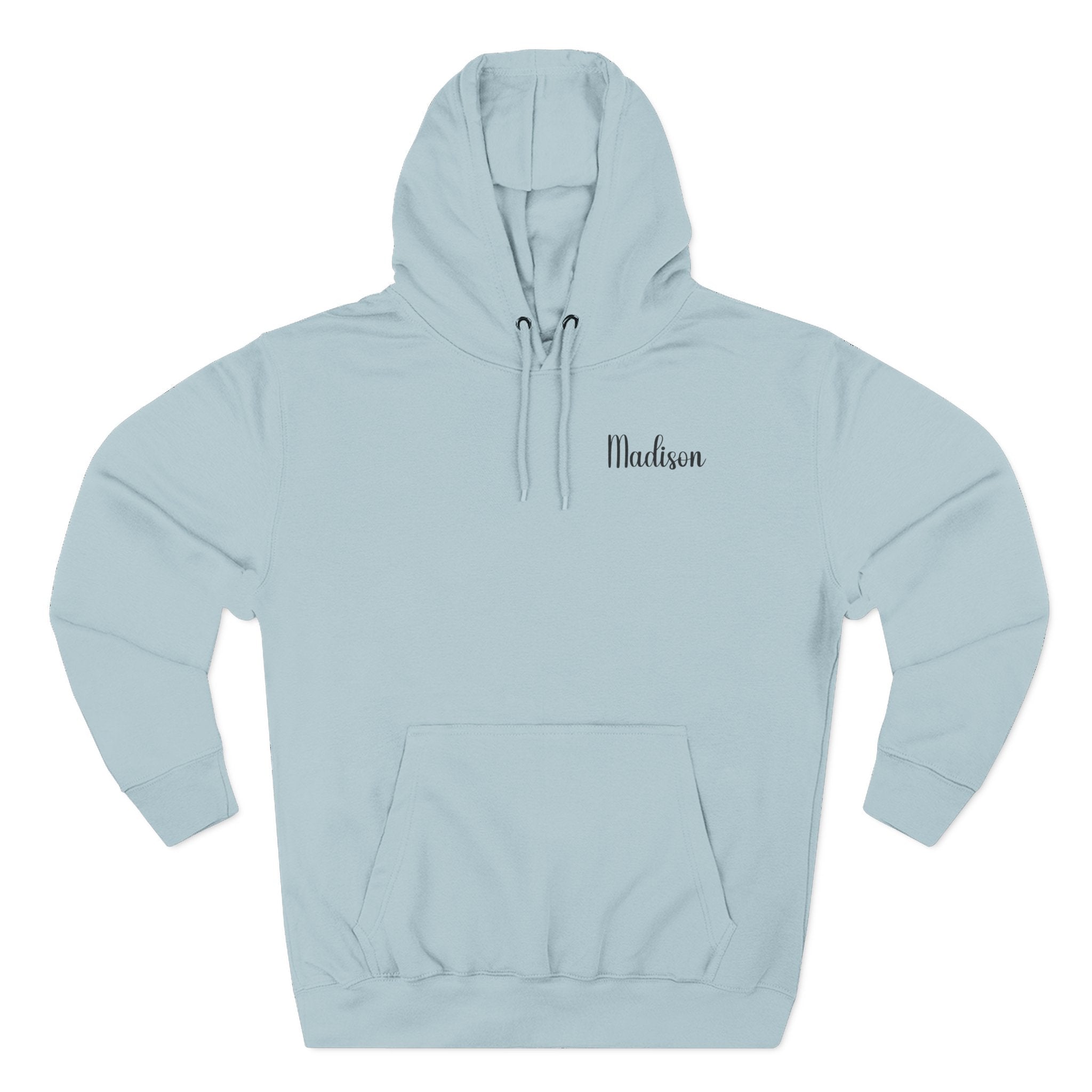 A light blue mist hoodie shown from the front, for Mom. featuring a graphic print on the back of the hoodie, of a green frog sitting on crossed red mushrooms with the text 'MOM'S LAST NERVE' and 'SEEDS - STRESS - BLOOMS'. 