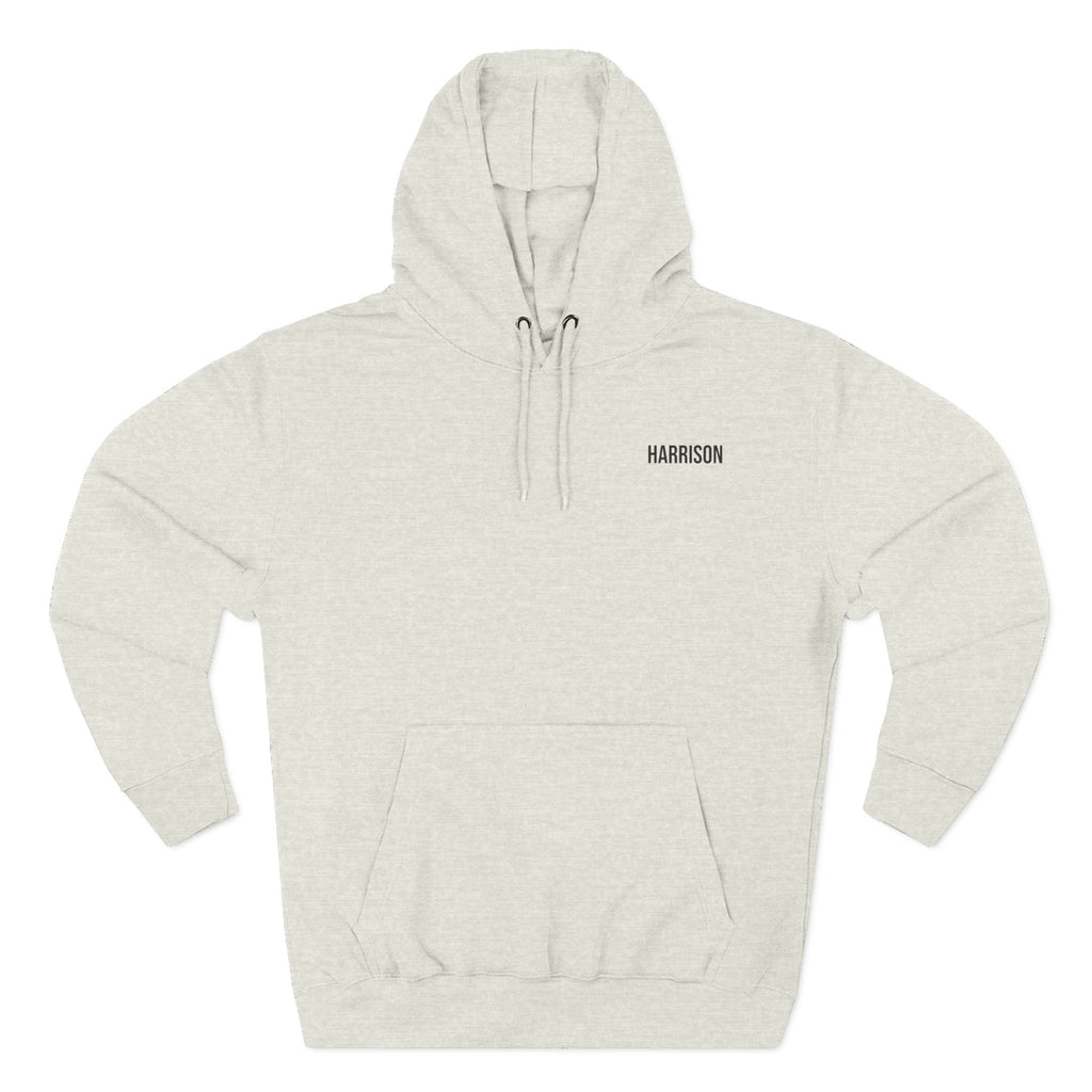 Front view of a oatmeal heather personalized hoodie printed with "Mountain Explorer – Wilderness" and embroidered with "Harrison". Special gift him, dad, granddad, boyfriend.
