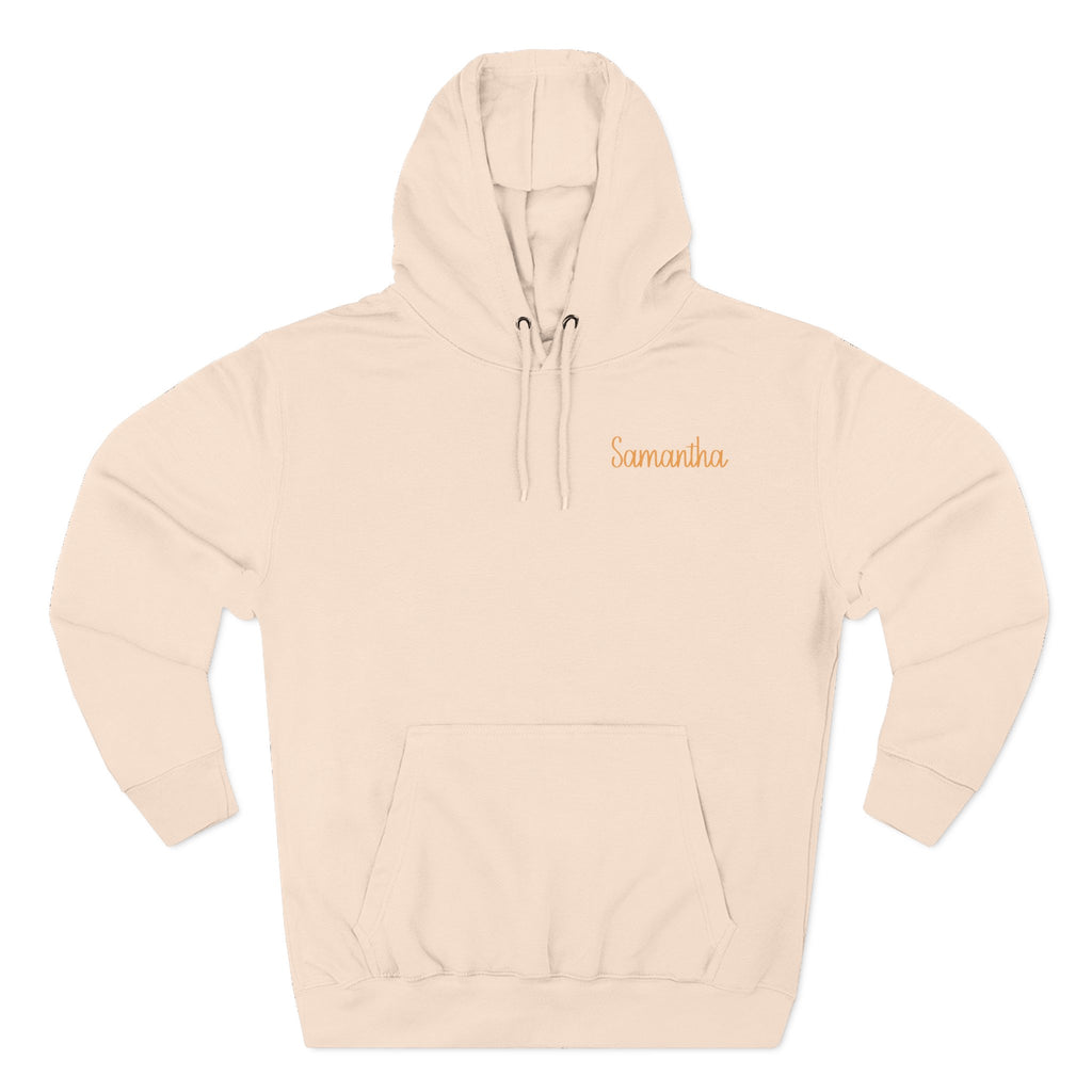 Back view of pale pink hoodie with hand-in-hand floral design