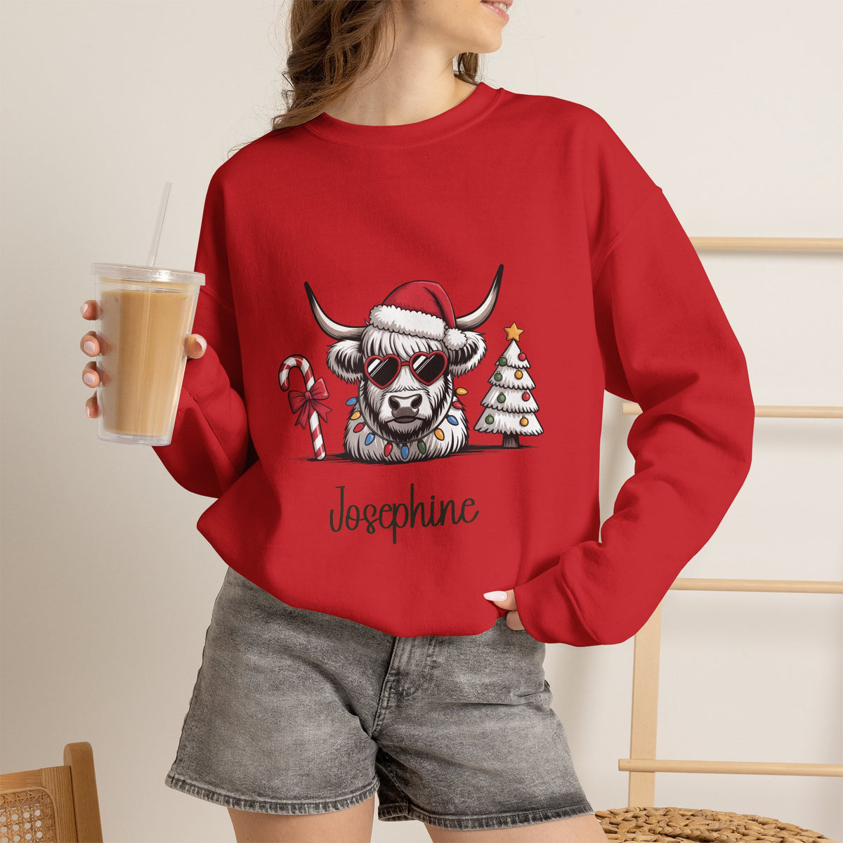 Red personalized Highland Cow Christmas sweatshirt, worn by model