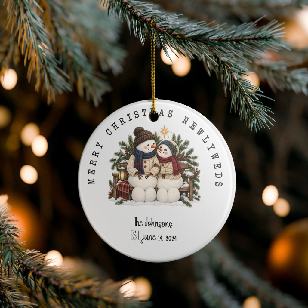 Merry Christmas Newlyweds ornament hanging on a lit Christmas tree, lifestyle photo