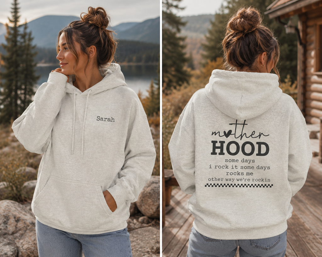 A woman modeling a light heather gray hoodie, shown from both the front and back. The front features the name 'Sarah' printed in black on the left chest, while the back displays a large graphic that reads 'mother HOOD' with a quote underneath. Special gift for mom