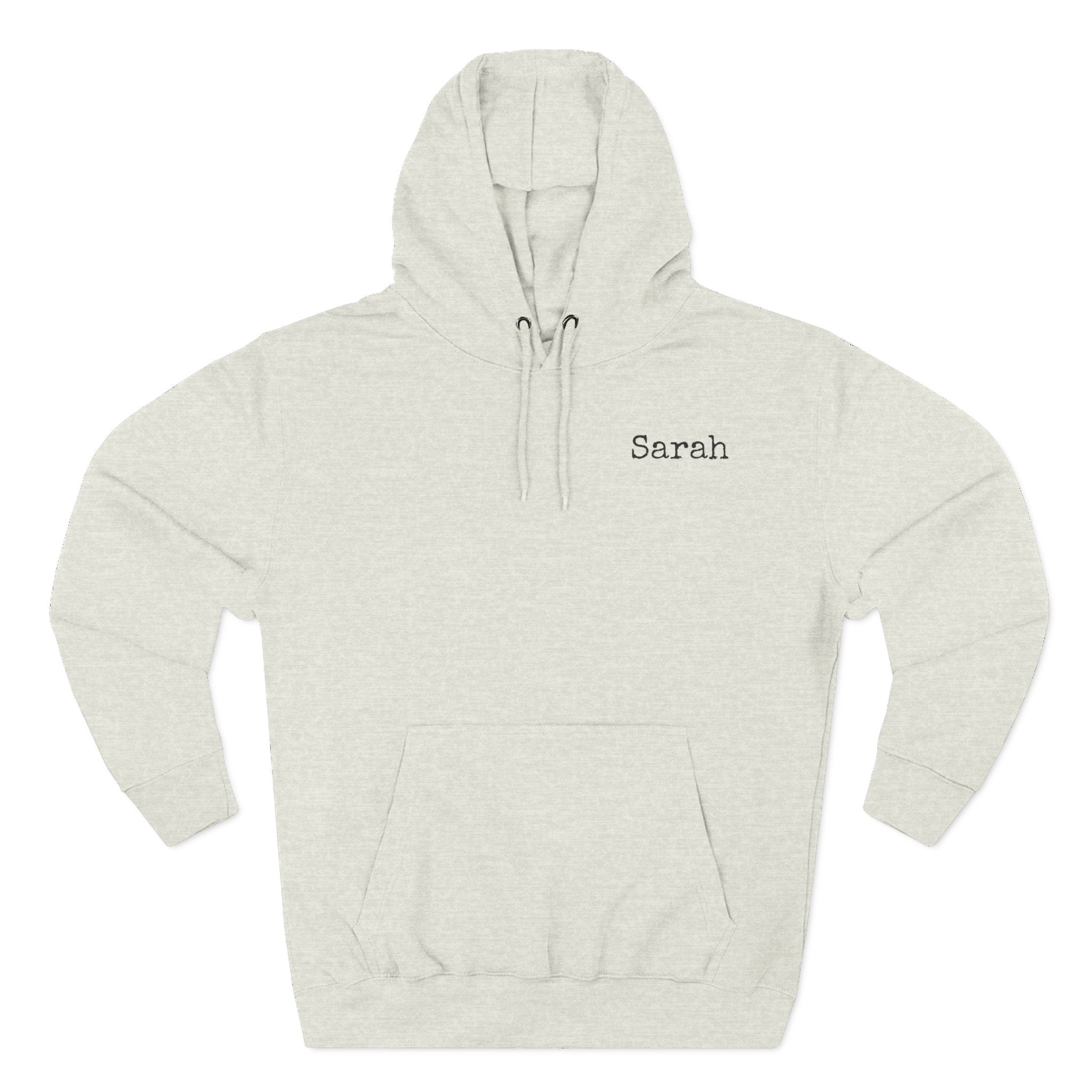 Front view of a oatmeal heather personalized hoodie printed with "Motherhood – Some Days I Rock It" and embroidered with "Sarah" Special gift for mom.