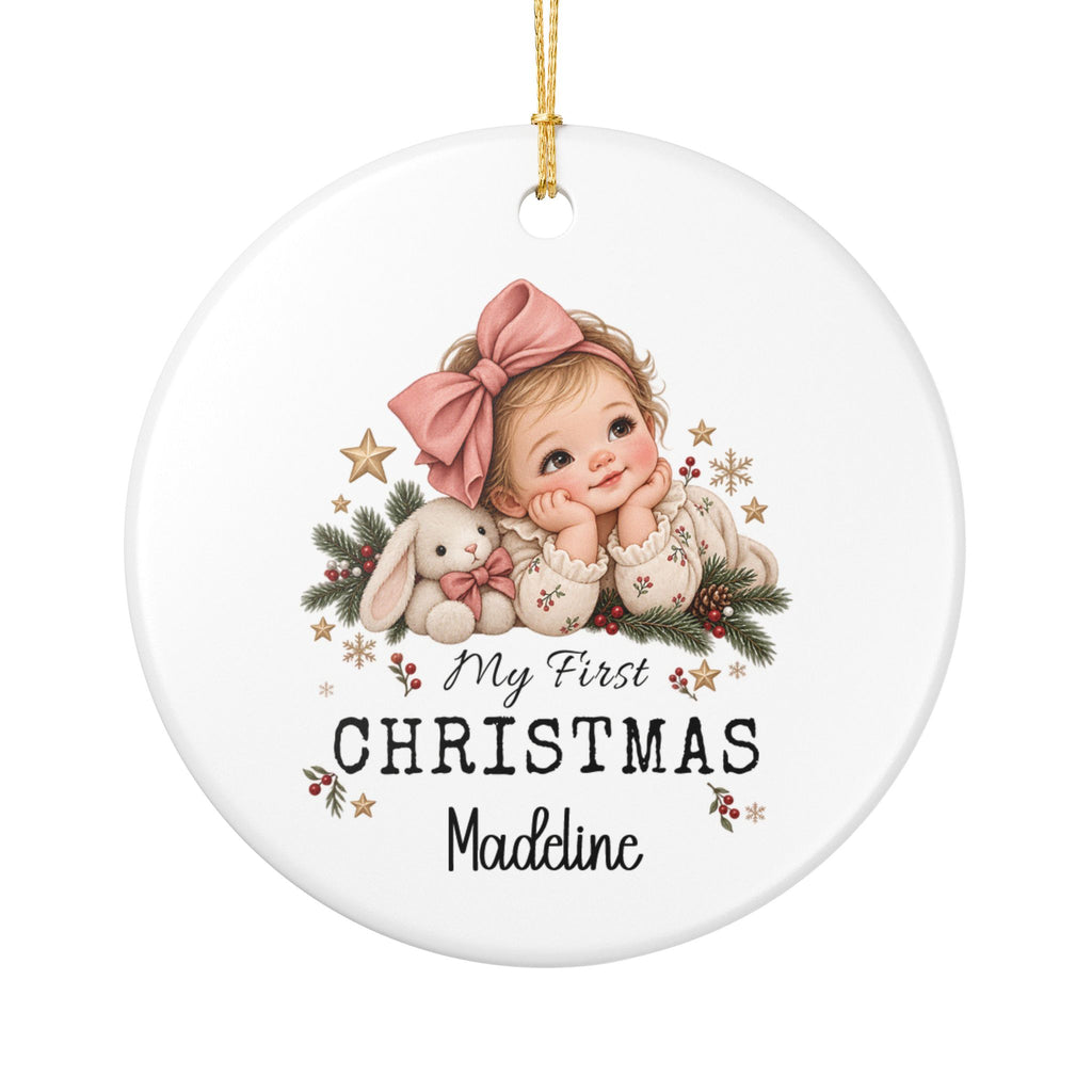 Personalized My First Christmas Baby Girl ornament with a baby girl in a pink bow, a white bunny and Christmas greenery, front view