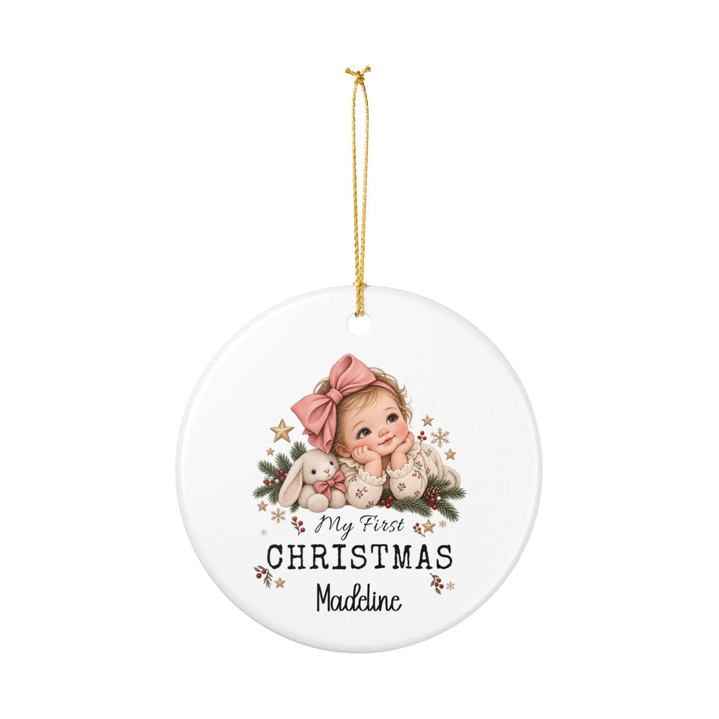 Personalized My First Christmas Baby Girl ornament hanging from its gold string