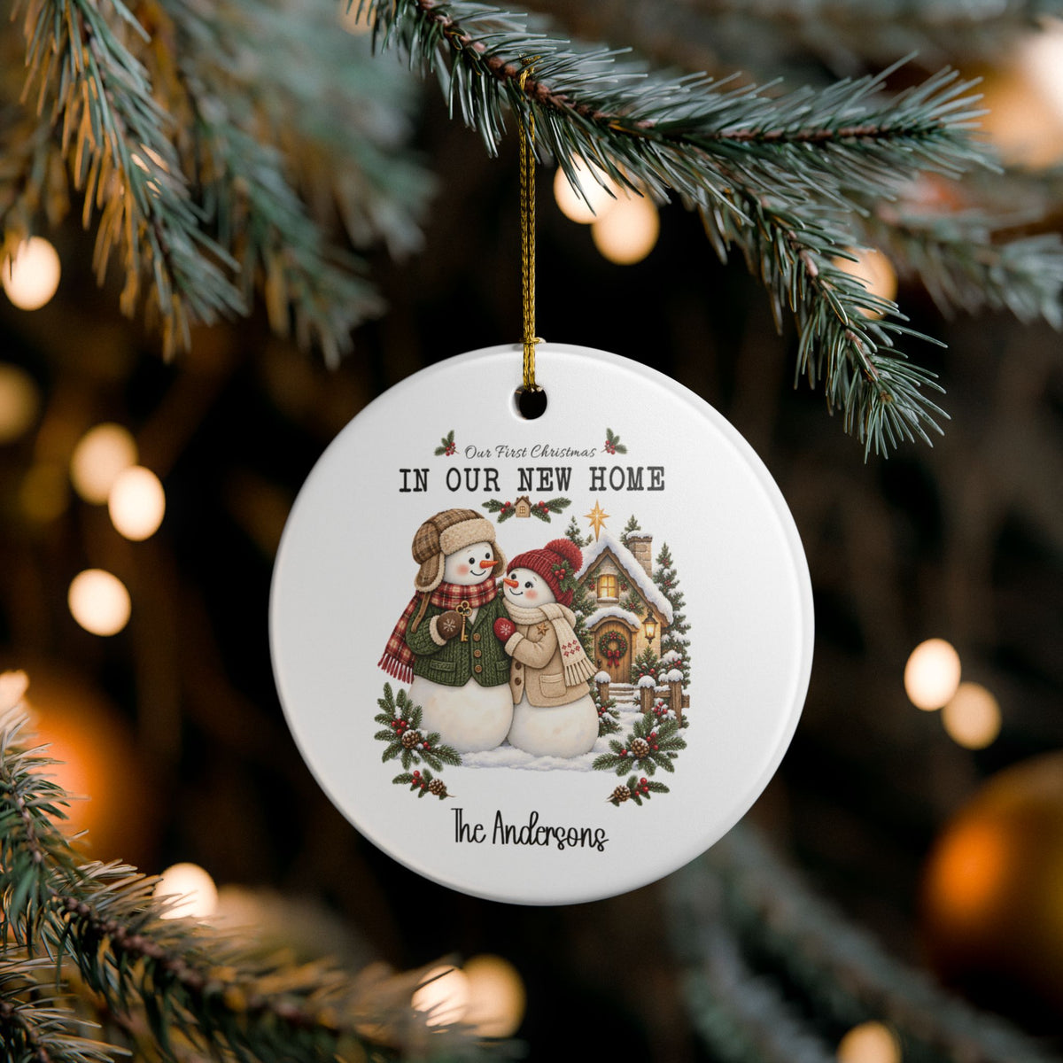 Custom new home Christmas ornament on pine branches with twinkling Christmas lights