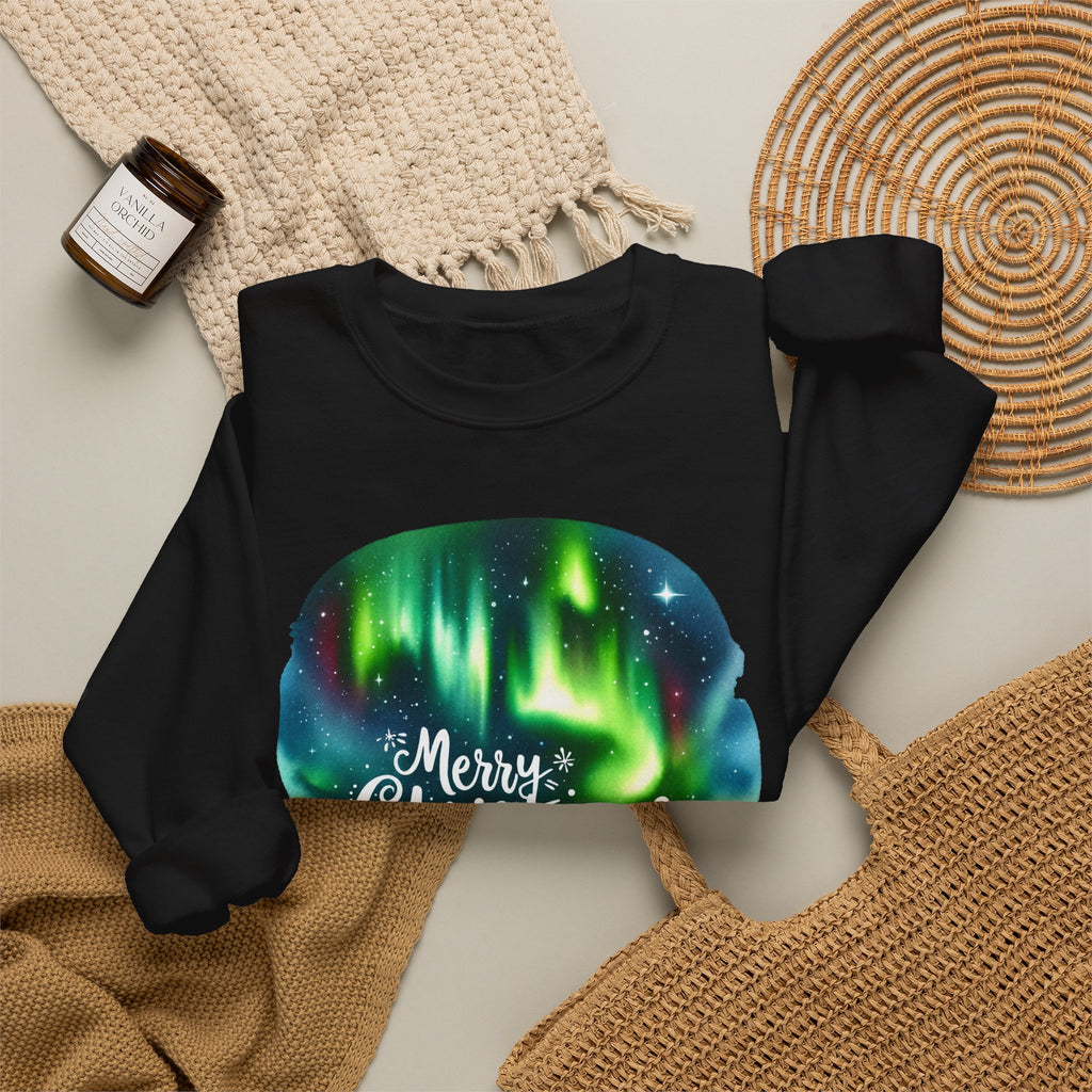 Black personalized Northern Lights Family Christmas sweatshirt, flat lay with cozy knit blanket