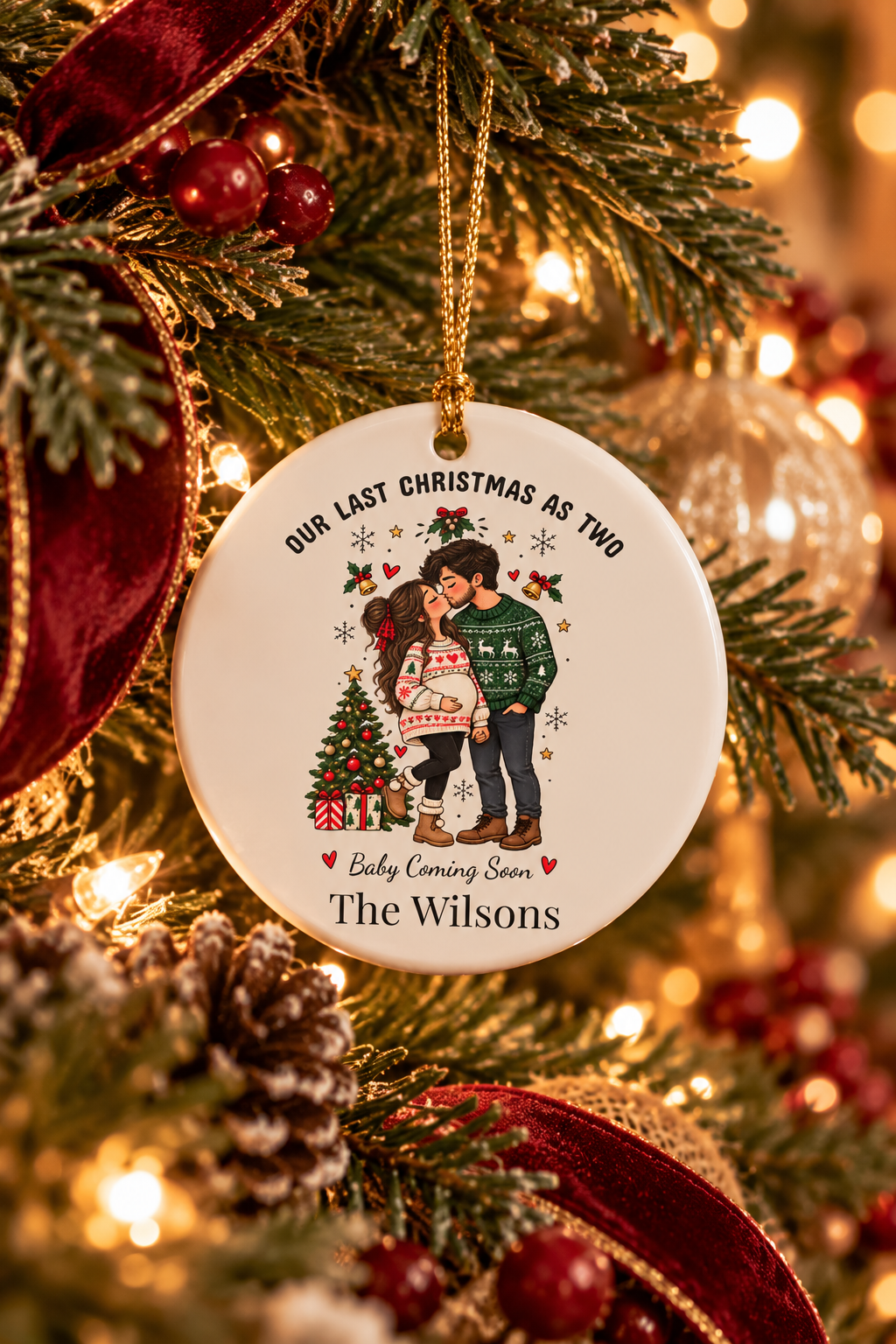 Personalized Our Last Christmas as Two ornament on a decorated Christmas tree with red ribbon and warm lights, lifestyle photo