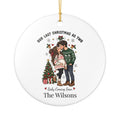 Personalized Our Last Christmas as Two ornament with an expecting couple sharing a kiss under the mistletoe beside the tree, front view