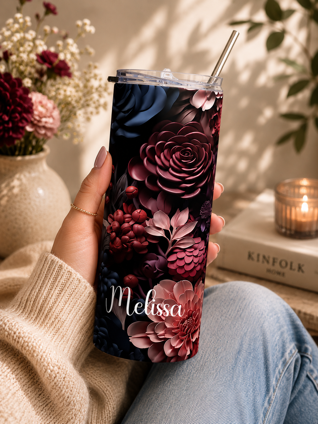 Dark floral tumbler held in hand in an everyday lifestyle scene