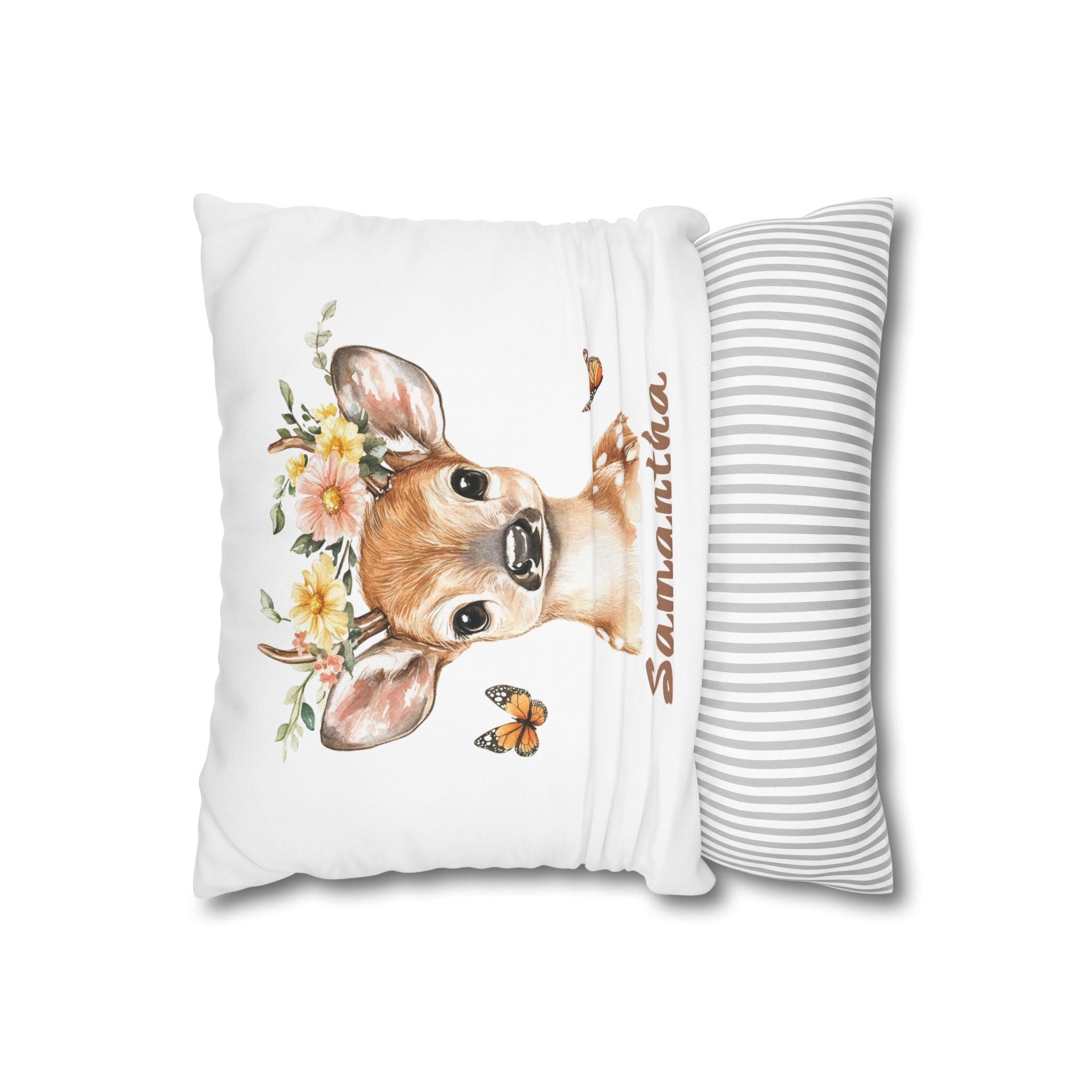 Baby deer name pillow styled on a nursery chair