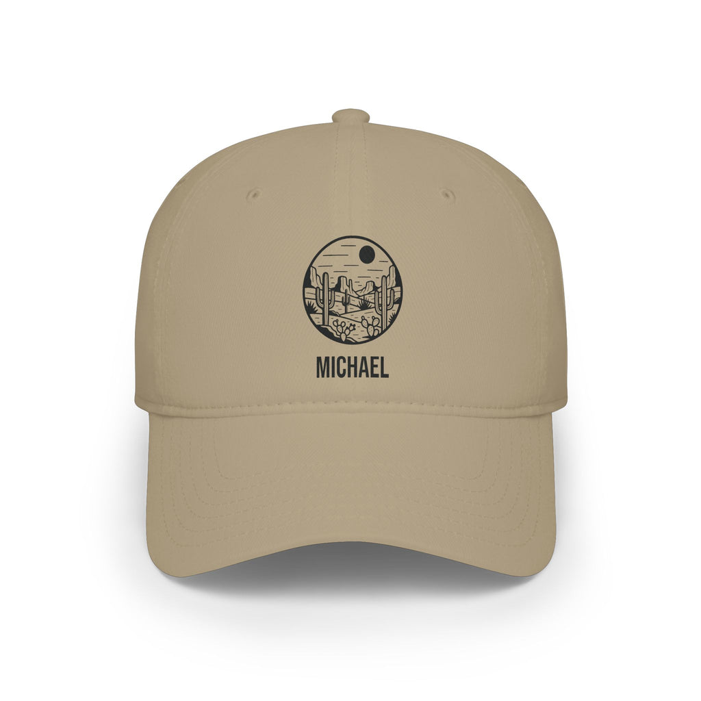 Khaki personalized desert cactus cap with detailed line-art desert scene with saguaro cacti, mesas and a sun in a round badge and the name Michael, front view