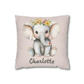 Personalized nursery pillow with a watercolour baby elephant in a floral crown on a blush background and a custom child's name