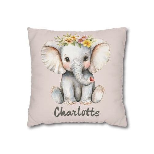 Personalized nursery pillow with a watercolour baby elephant in a floral crown on a blush background and a custom child's name