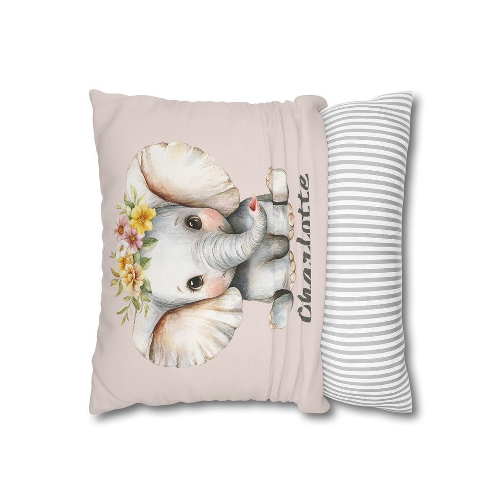 Baby elephant name pillow styled on a nursery chair
