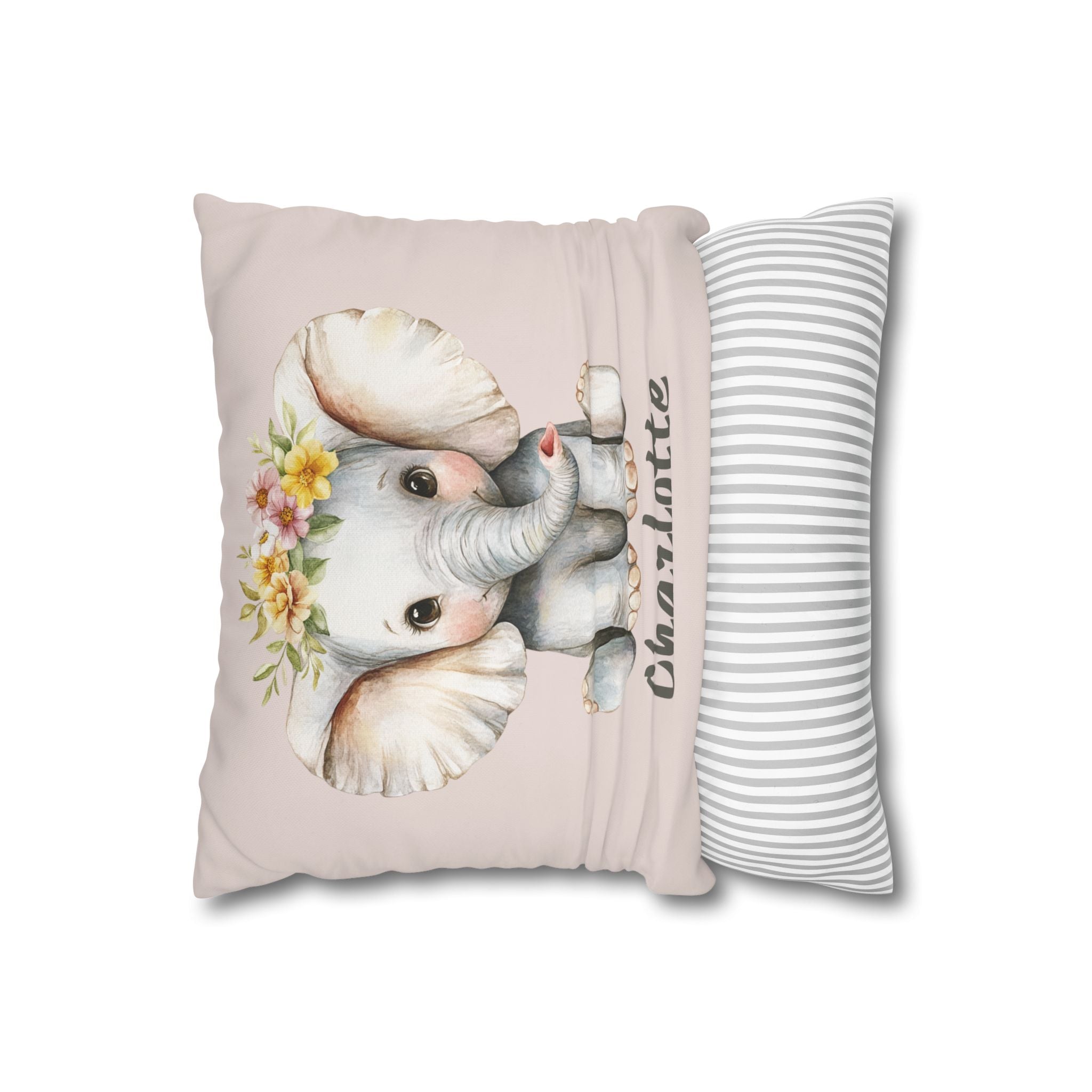 Baby elephant name pillow styled on a nursery chair