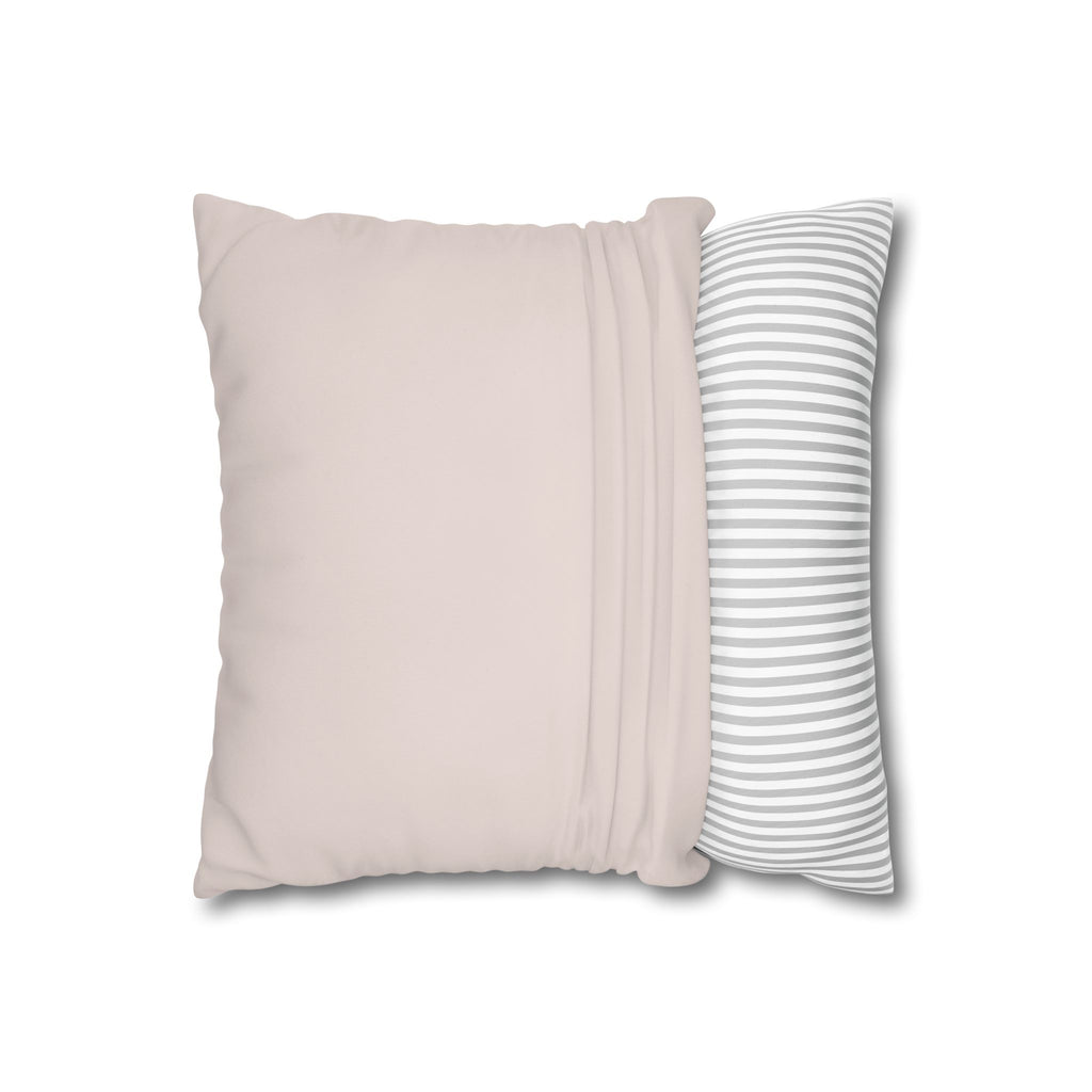 Baby elephant nursery pillow resting on a sofa
