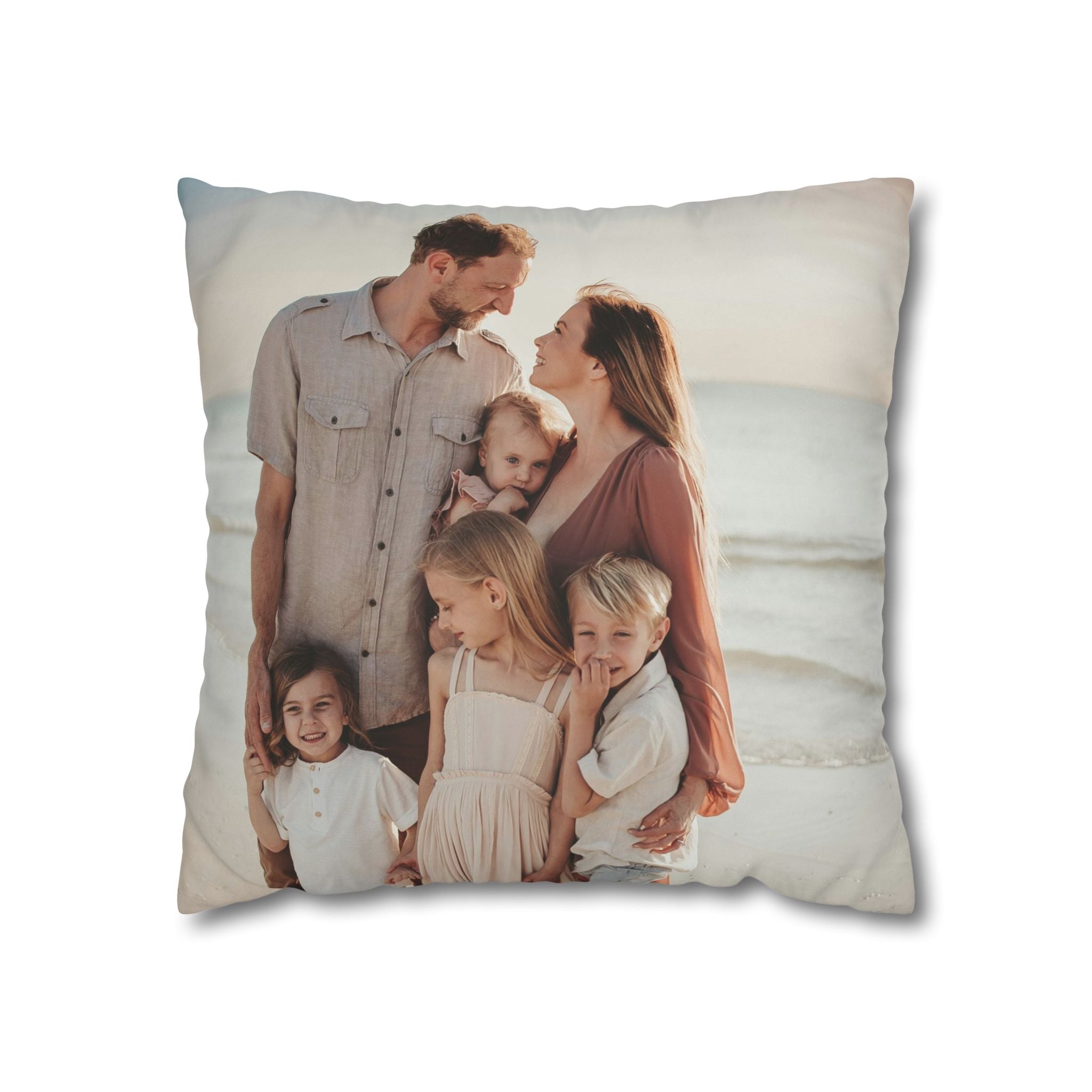 Personalized family photo pillow styled on a living-room sofa
