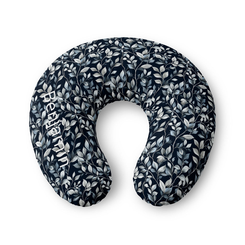 Personalized nursing pillow cover in navy with silver-blue botanical leaves and a custom baby name