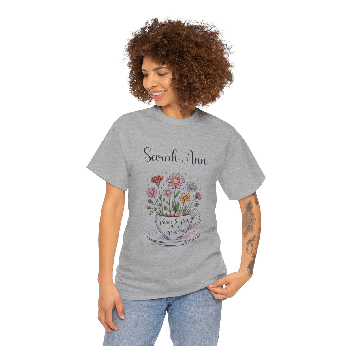 Peace Begins with a Cup of Tea t-shirt on a hanger
