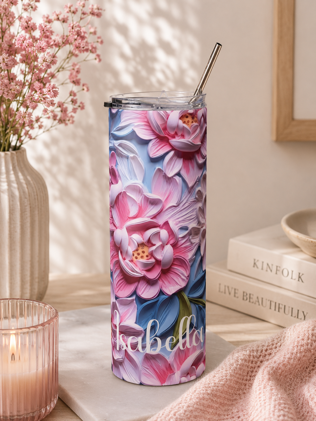 Pink peony skinny tumbler styled with soft floral props in a lifestyle scene
