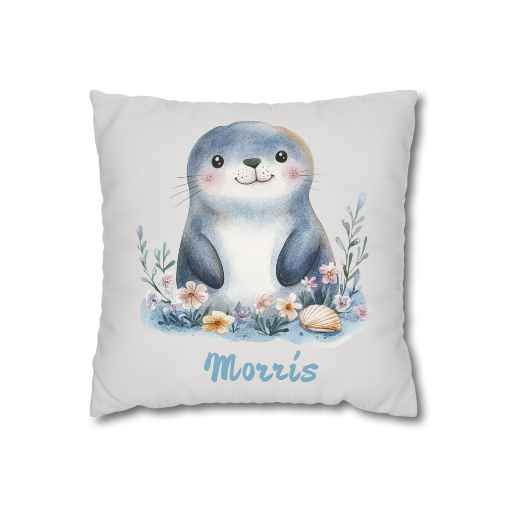 Personalized nursery pillow with a watercolour baby seal among flowers and a seashell and a custom child's name