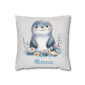 Personalized nursery pillow with a watercolour baby seal among flowers and a seashell and a custom child's name
