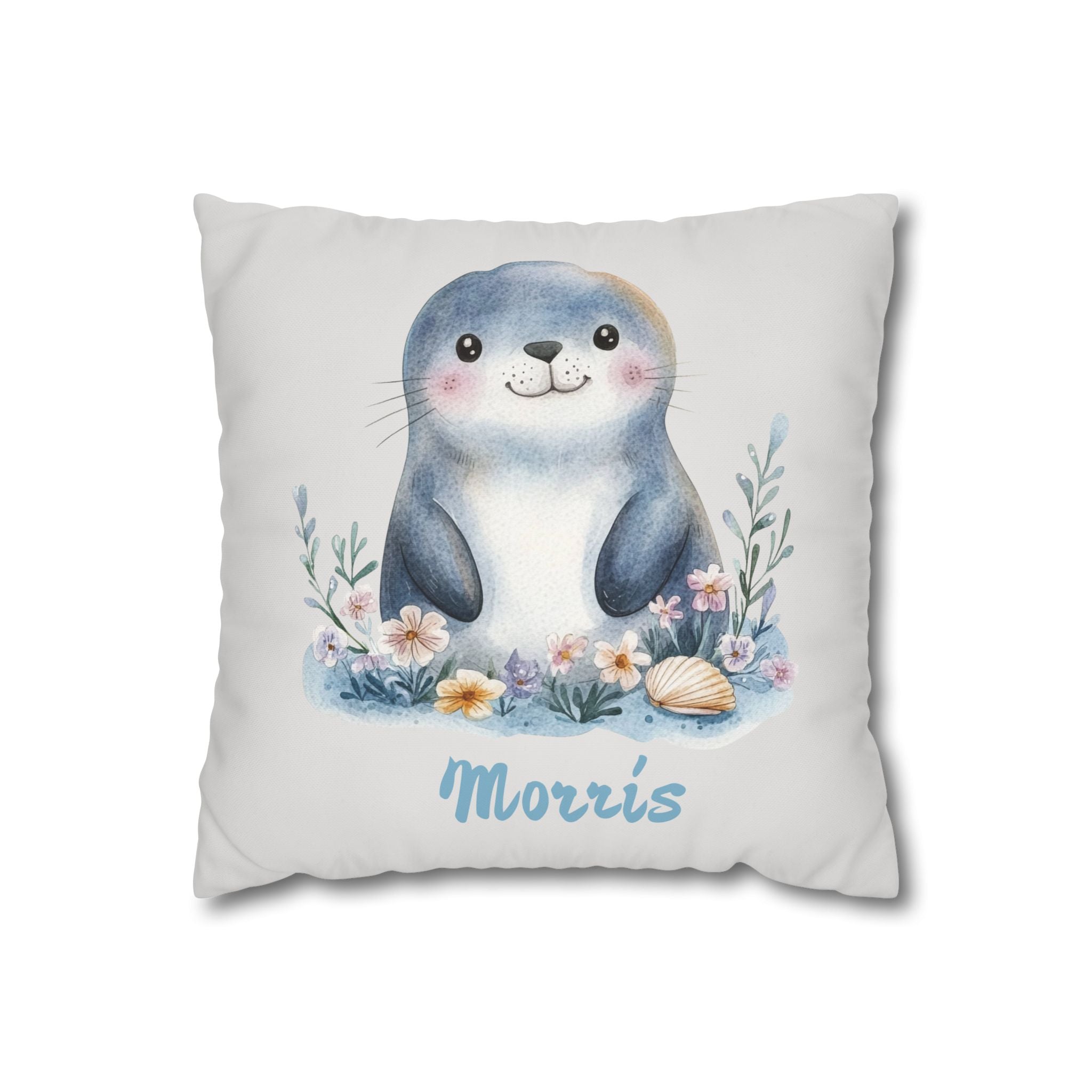 Personalized nursery pillow with a watercolour baby seal among flowers and a seashell and a custom child's name