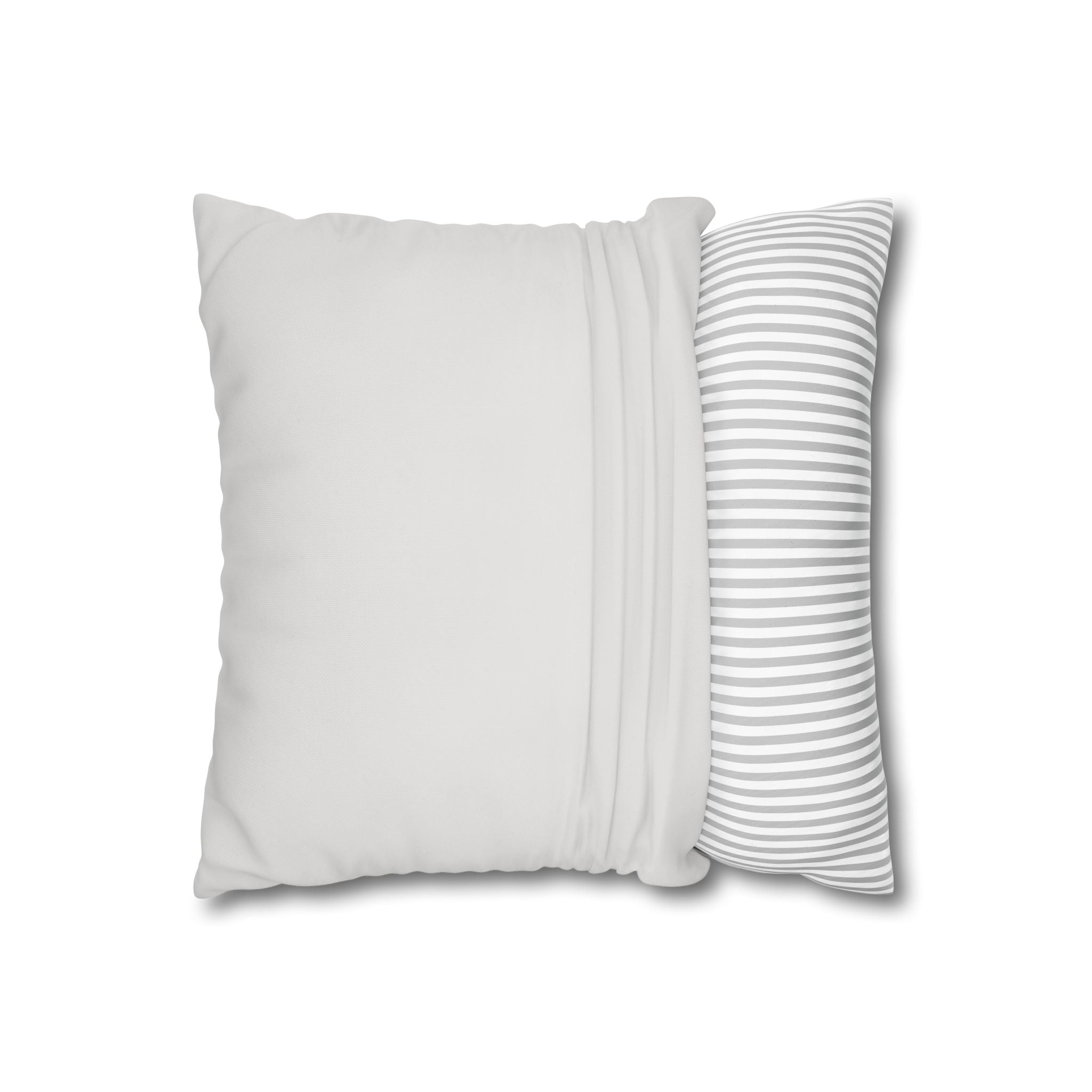 Baby seal nursery pillow resting on a sofa